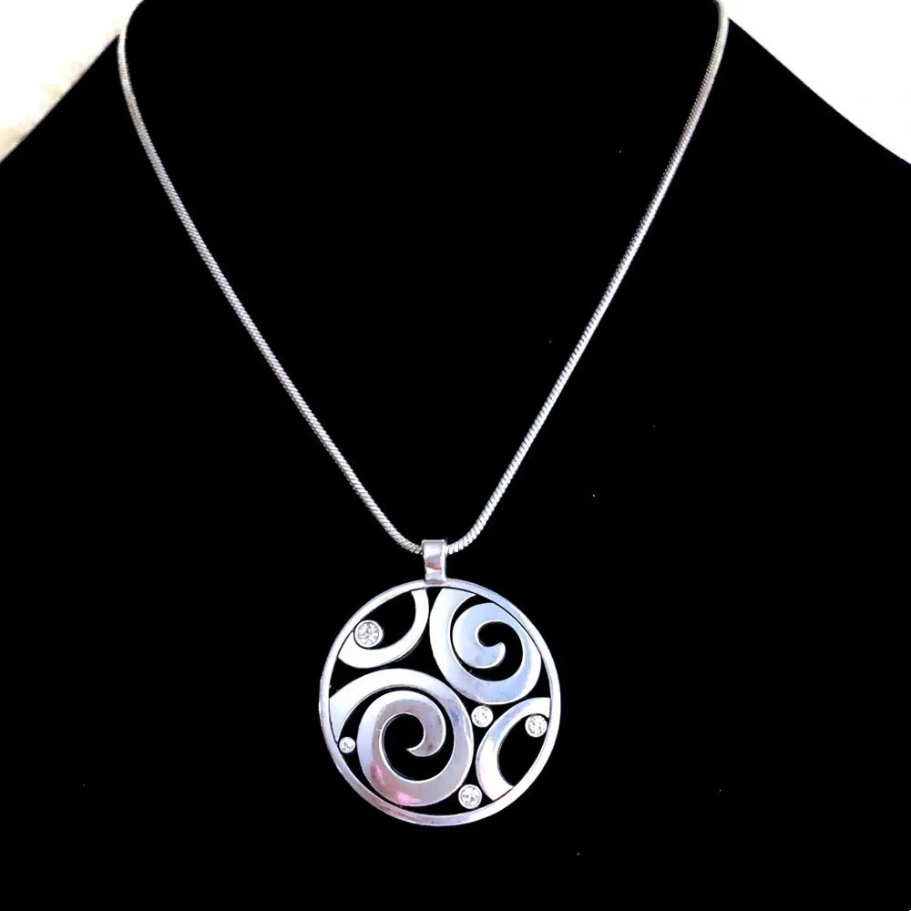 Brighton necklace round medallion with crystals against the beautiful chain